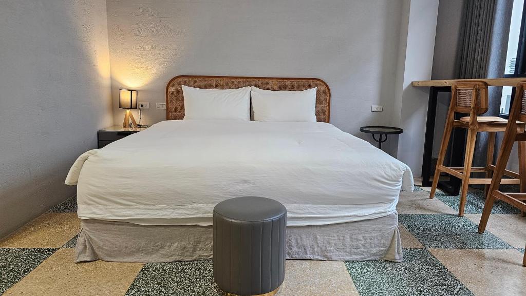 Postel nebo postele na pokoji v ubytování 璿 旅 Syuan Hotel