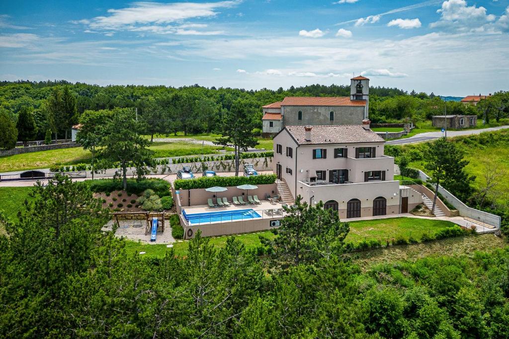 an aerial view of a large white house with a pool at Luxury Pool Villa Gradin - Happy Rentals in Gračišče