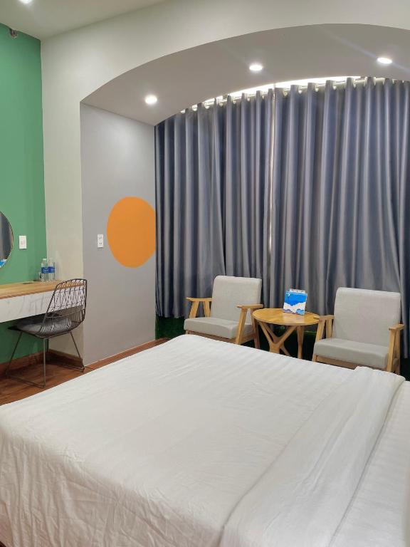 Postel nebo postele na pokoji v ubytování POTA Hotel & Apartment