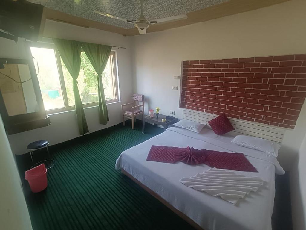 Postel nebo postele na pokoji v ubytování Shamus Javed Homestay