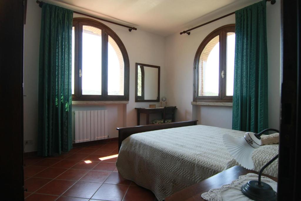 Posteľ alebo postele v izbe v ubytovaní Agriturismo La Steccaia Alta
