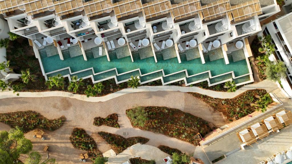 an aerial view of a resort with a pool at The Signature Level at TRS Ibiza Hotel - All Inclusive Adults Only - Entrance to Clubs included in San Antonio