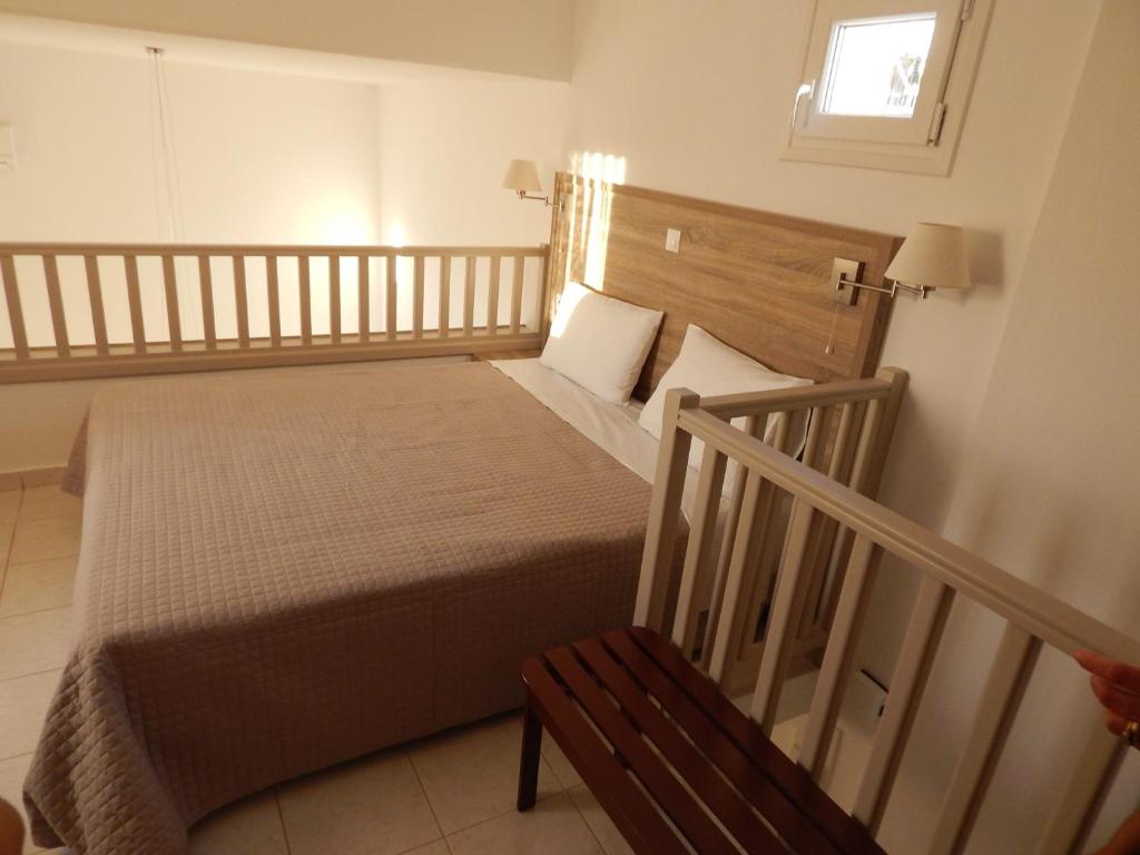 Postel nebo postele na pokoji v ubytování Epiphany Apartments