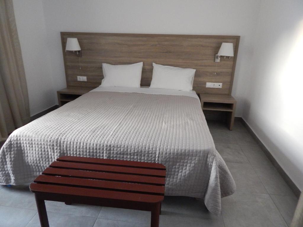Postel nebo postele na pokoji v ubytování Epiphany Apartments