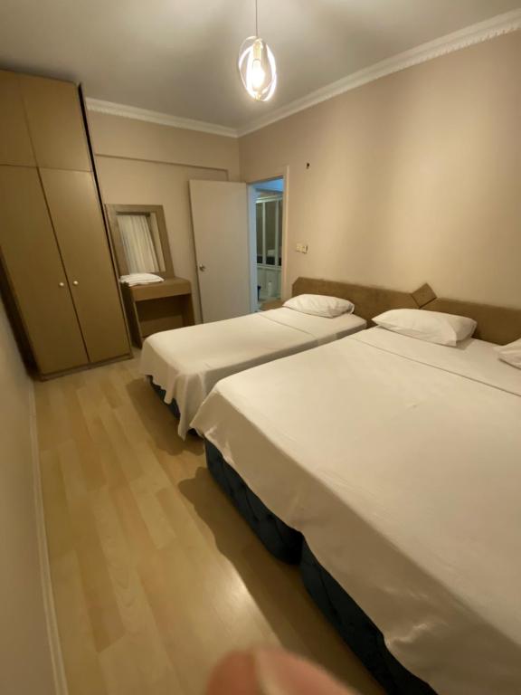 Postel nebo postele na pokoji v ubytování EVİM APART HOTEL