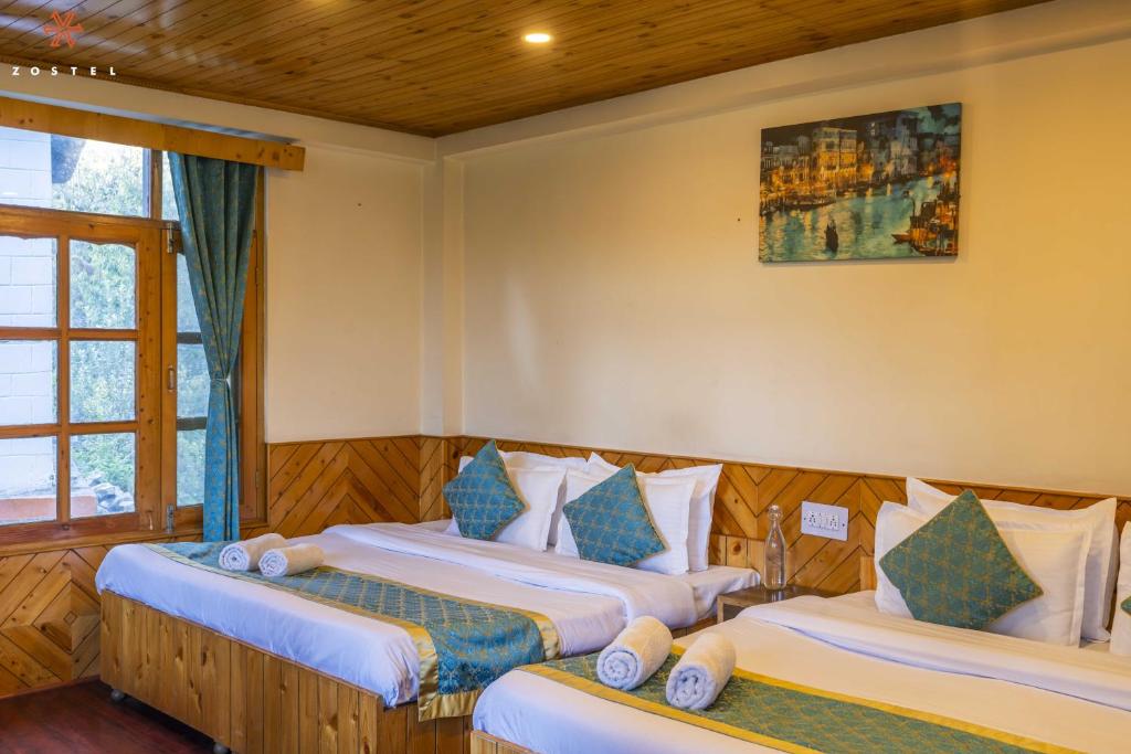 Postel nebo postele na pokoji v ubytování Zostel Old Manali