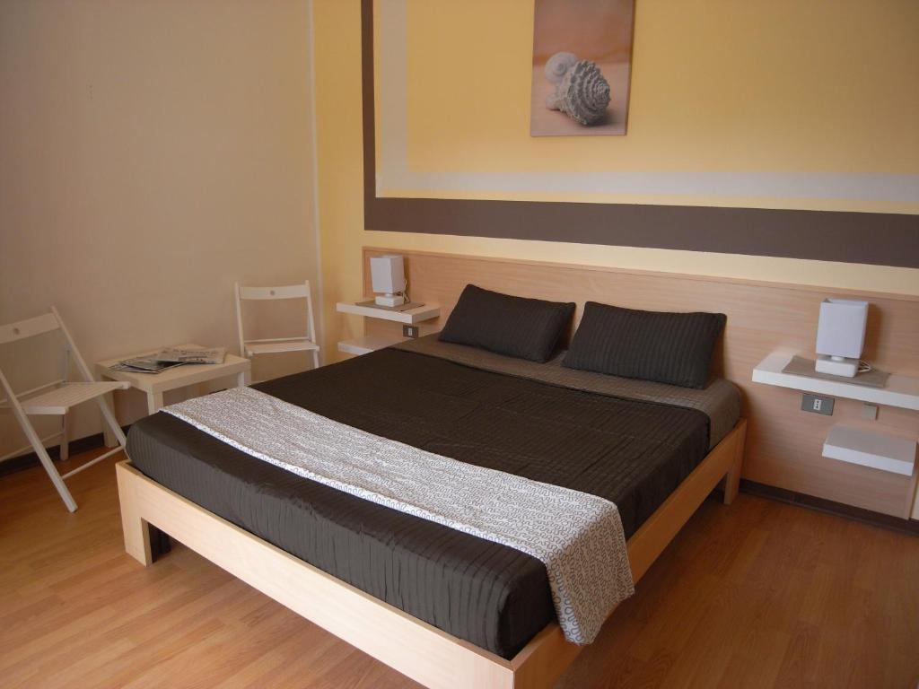 Postel nebo postele na pokoji v ubytování Hotel Moreri