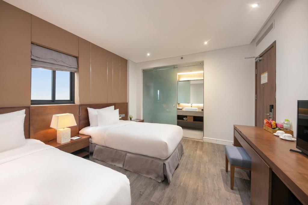 Postel nebo postele na pokoji v ubytování Avora Hotel