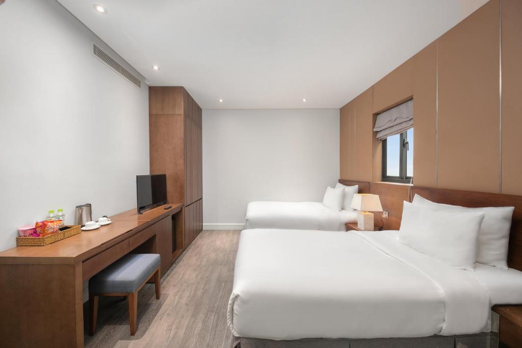 Postel nebo postele na pokoji v ubytování Avora Hotel