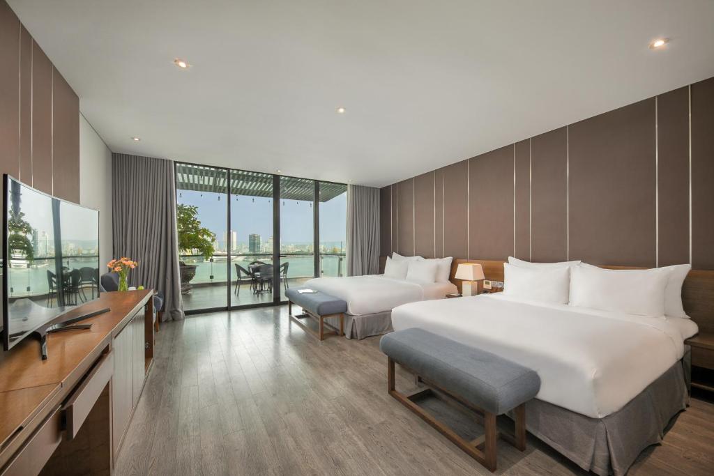 Postel nebo postele na pokoji v ubytování Avora Hotel