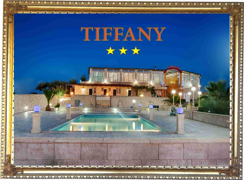 
a painting of a swimming pool in front of a building at Hotel Bed&Breakfast Tiffany in Campobello di Licata
