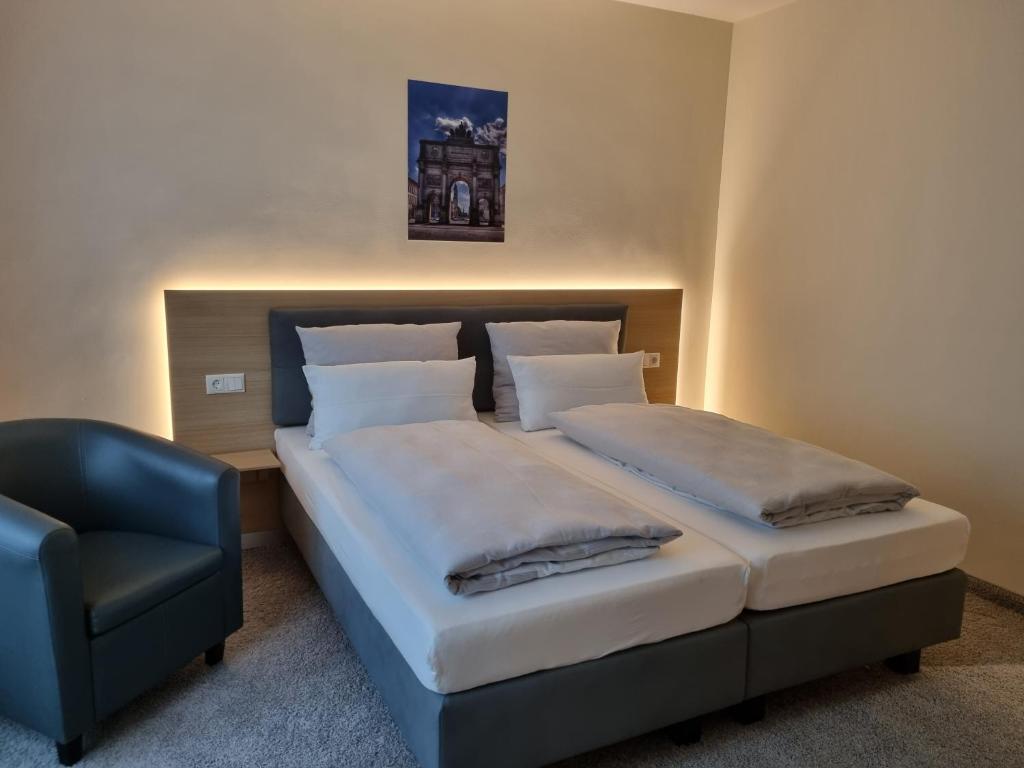 Postel nebo postele na pokoji v ubytování myMINGA13 - Hotel & serviced Apartments