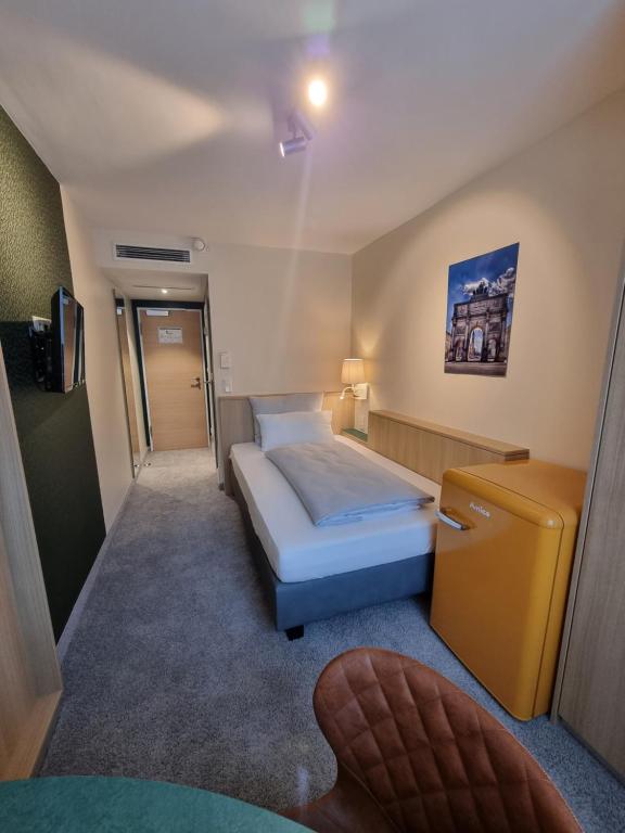Postel nebo postele na pokoji v ubytování myMINGA13 - Hotel & serviced Apartments