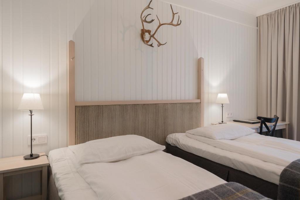 Postel nebo postele na pokoji v ubytování Hotel Bishops Arms Piteå