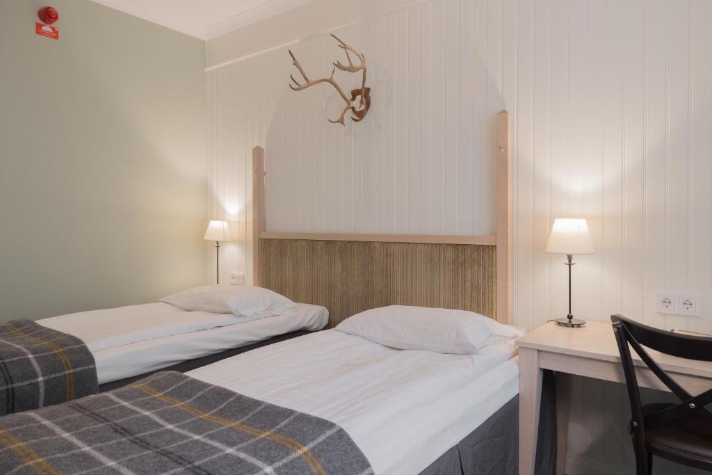 Postel nebo postele na pokoji v ubytování Hotel Bishops Arms Piteå