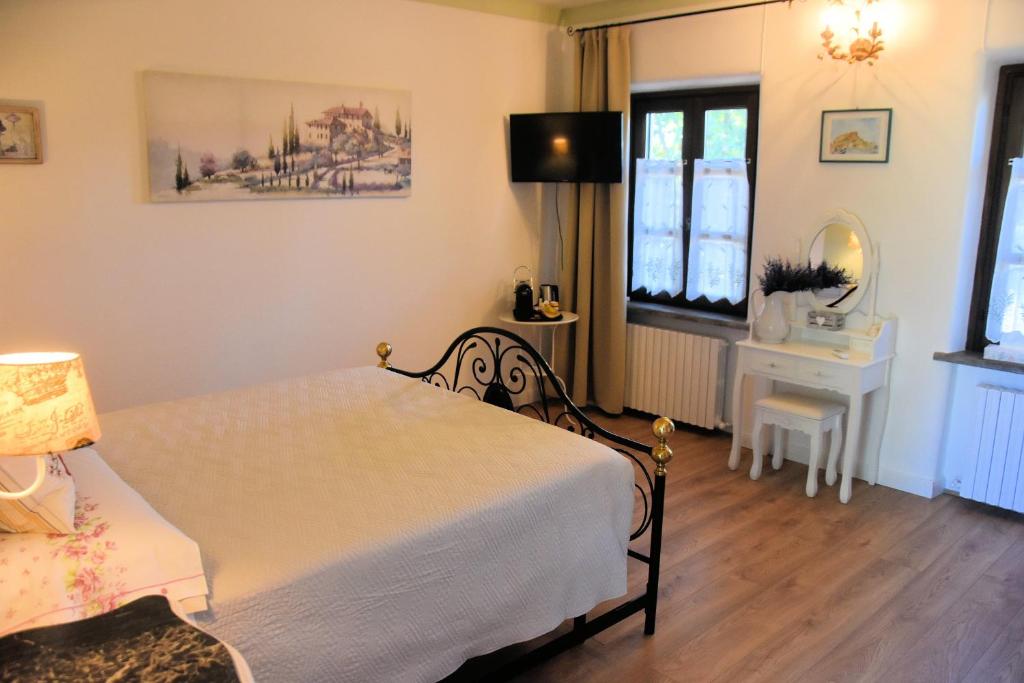 Postel nebo postele na pokoji v ubytování Guest House La Carolina