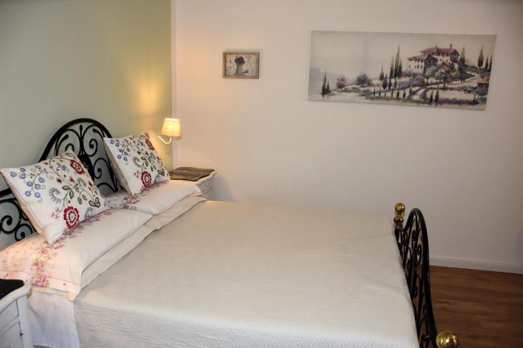 Postel nebo postele na pokoji v ubytování Guest House La Carolina