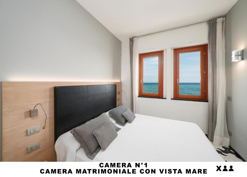 Postel nebo postele na pokoji v ubytování Affittacamere Lo Scoglio (Guesthouse)