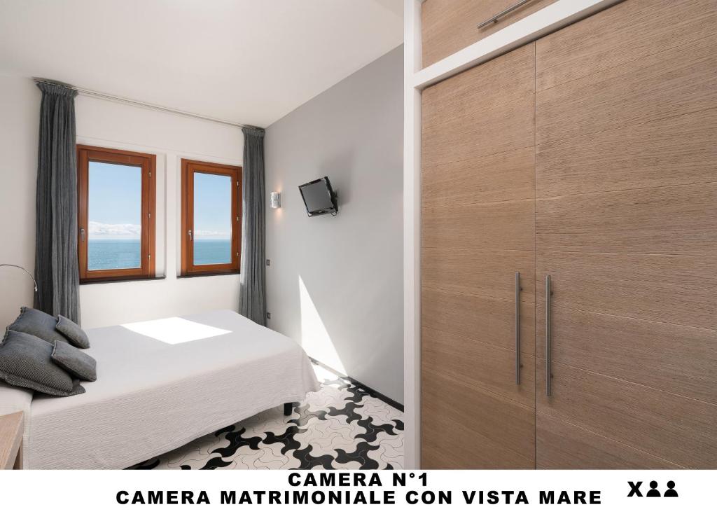 Postel nebo postele na pokoji v ubytování Affittacamere Lo Scoglio (Guesthouse)