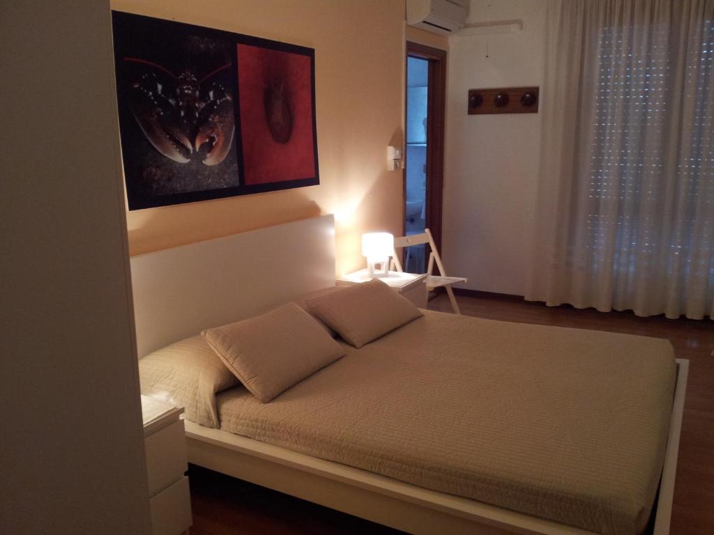 Postel nebo postele na pokoji v ubytování Hotel Moreri