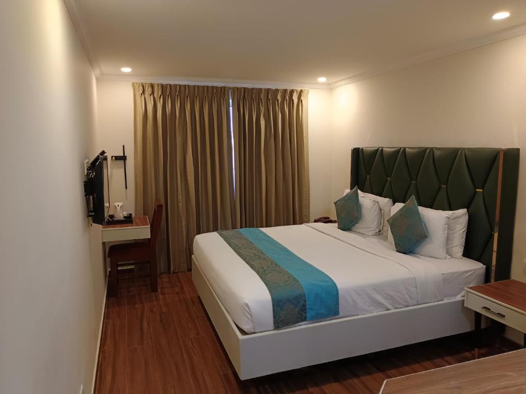 Postel nebo postele na pokoji v ubytování Hotel Grand Residence