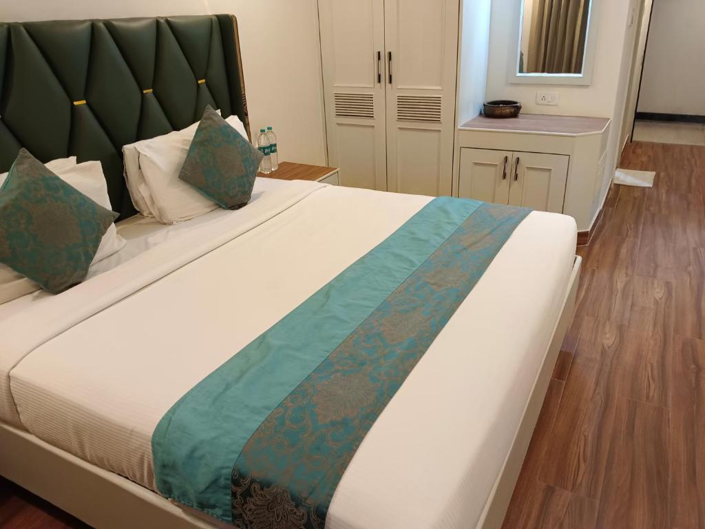 Postel nebo postele na pokoji v ubytování Hotel Grand Residence