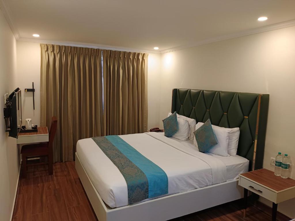 Postel nebo postele na pokoji v ubytování Hotel Grand Residence