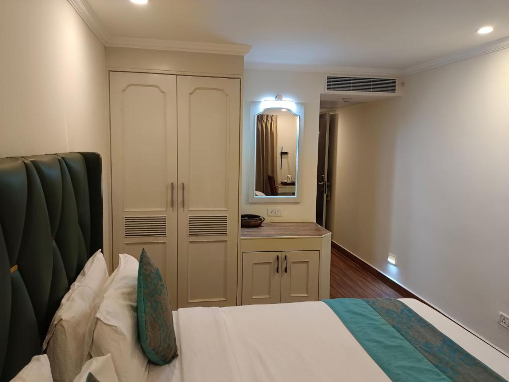 Postel nebo postele na pokoji v ubytování Hotel Grand Residence