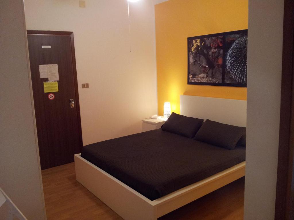 Postel nebo postele na pokoji v ubytování Hotel Moreri