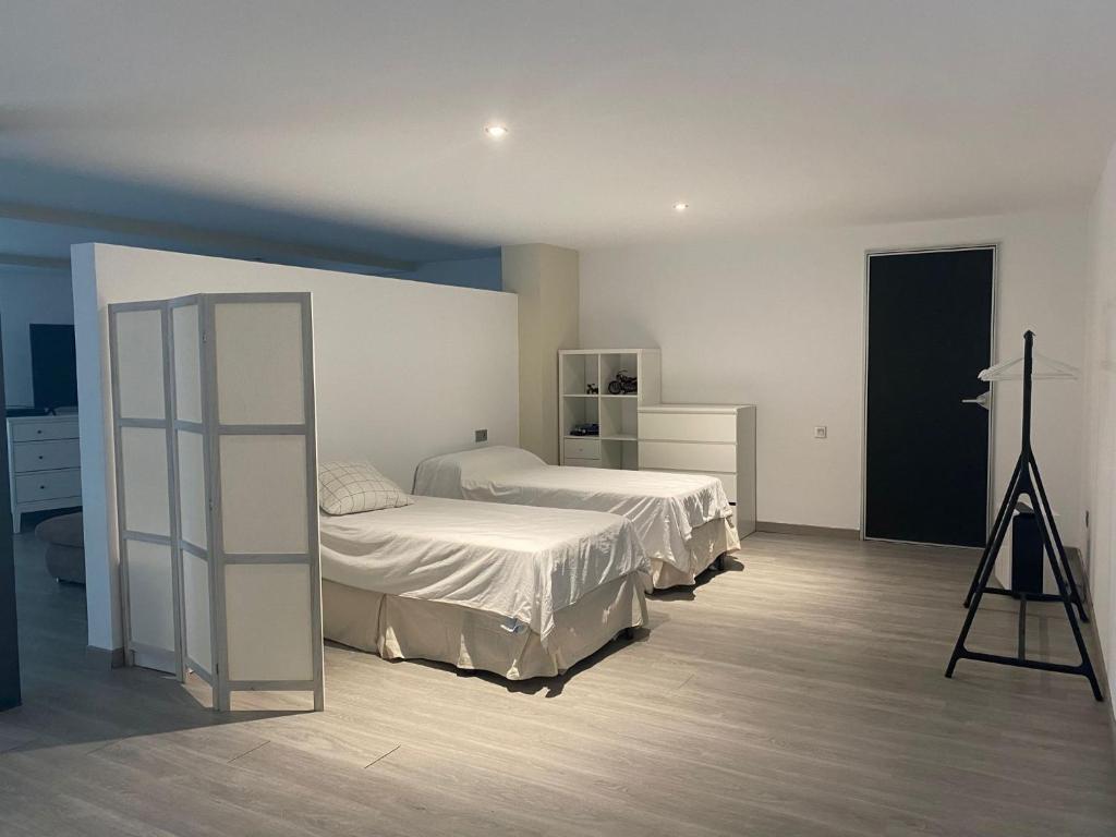 A bed or beds in a room at Apartamento en playa de la Albufereta