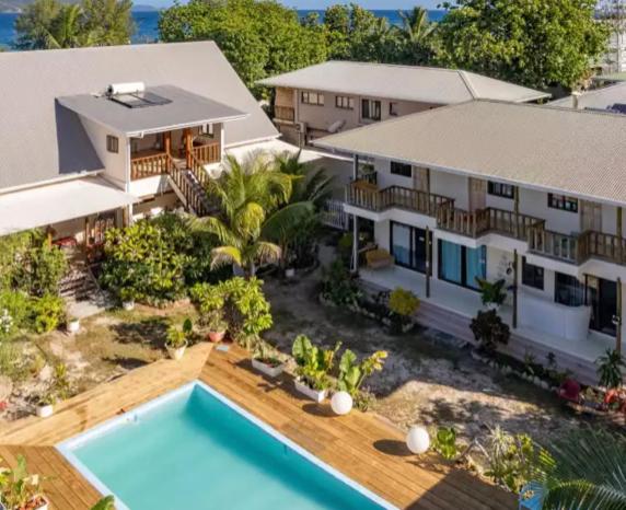 an aerial view of a house with a swimming pool at Hyde-Tide Guesthouse in La Digue