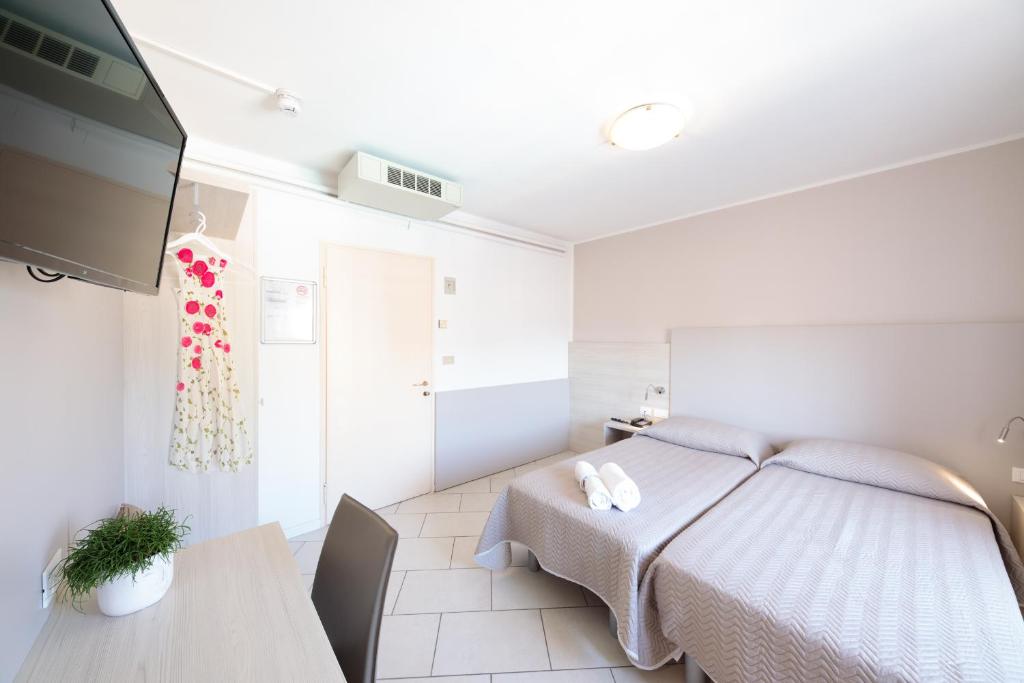 Postel nebo postele na pokoji v ubytování Hotel Madison