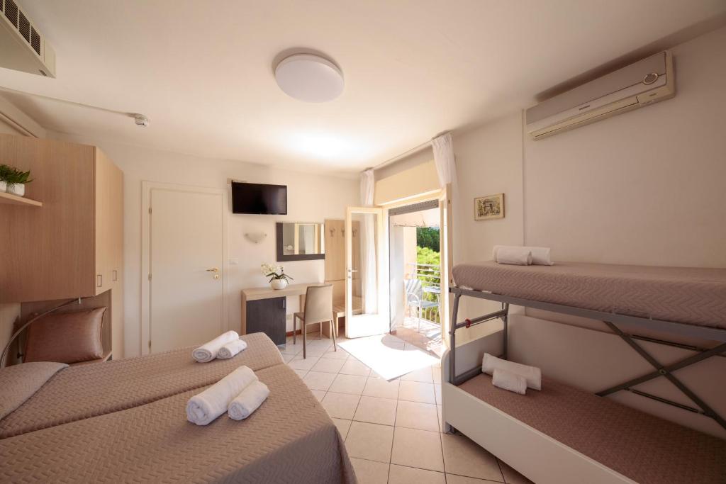 Postel nebo postele na pokoji v ubytování Hotel Madison