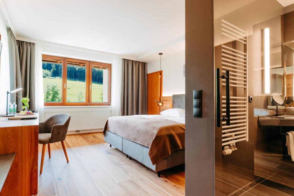 Postel nebo postele na pokoji v ubytování Seminarhotel Lengbachhof GmbH