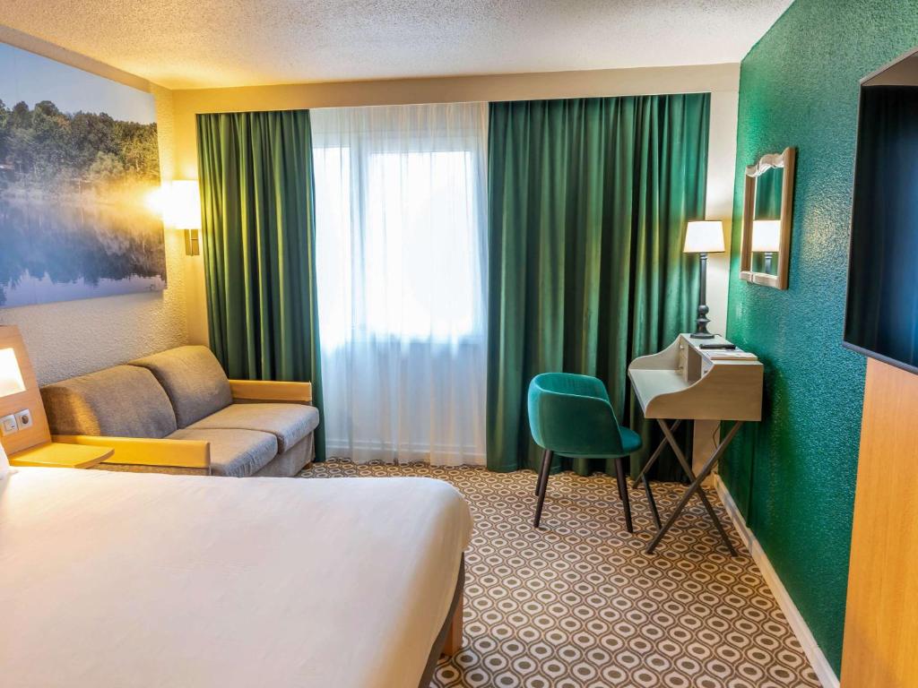 Postel nebo postele na pokoji v ubytování Novotel Orléans Chemins De Sologne Demeures De Campagne