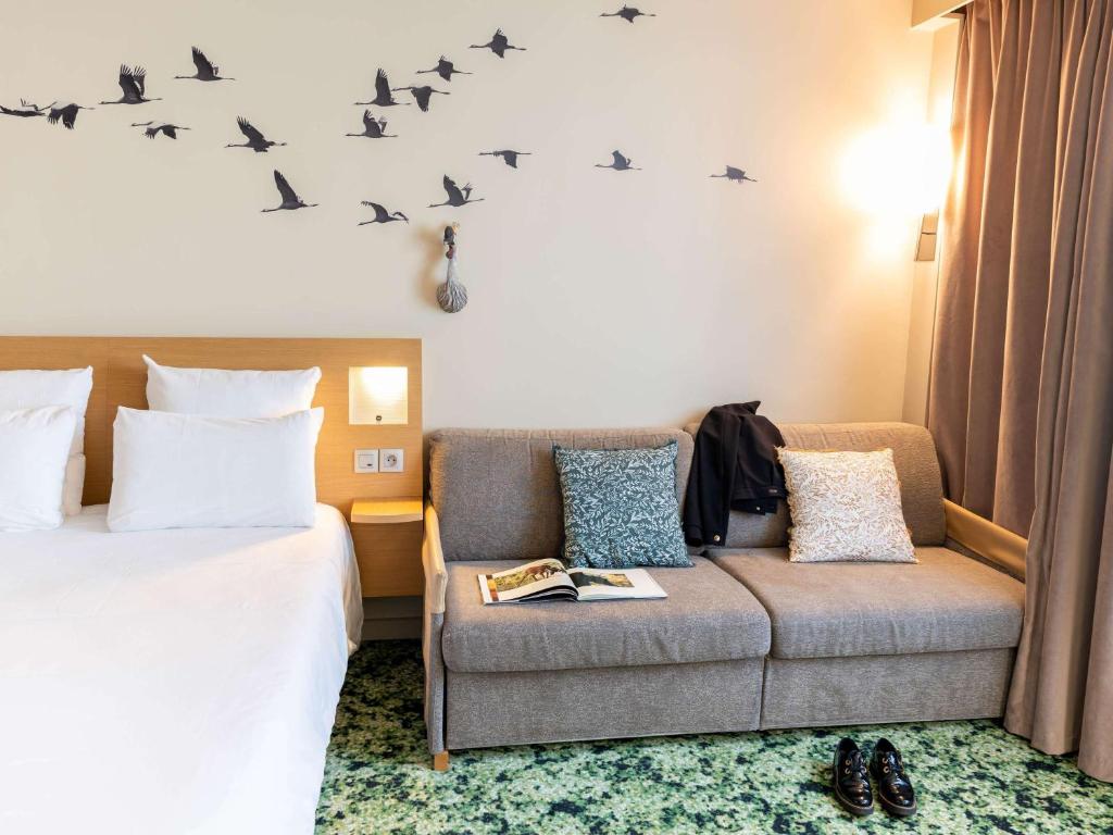 Postel nebo postele na pokoji v ubytování Novotel Orléans Chemins De Sologne Demeures De Campagne