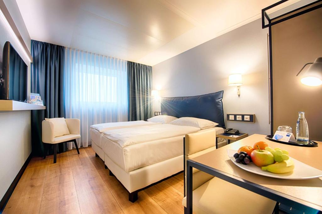 Postel nebo postele na pokoji v ubytování Congress Hotel Chemnitz