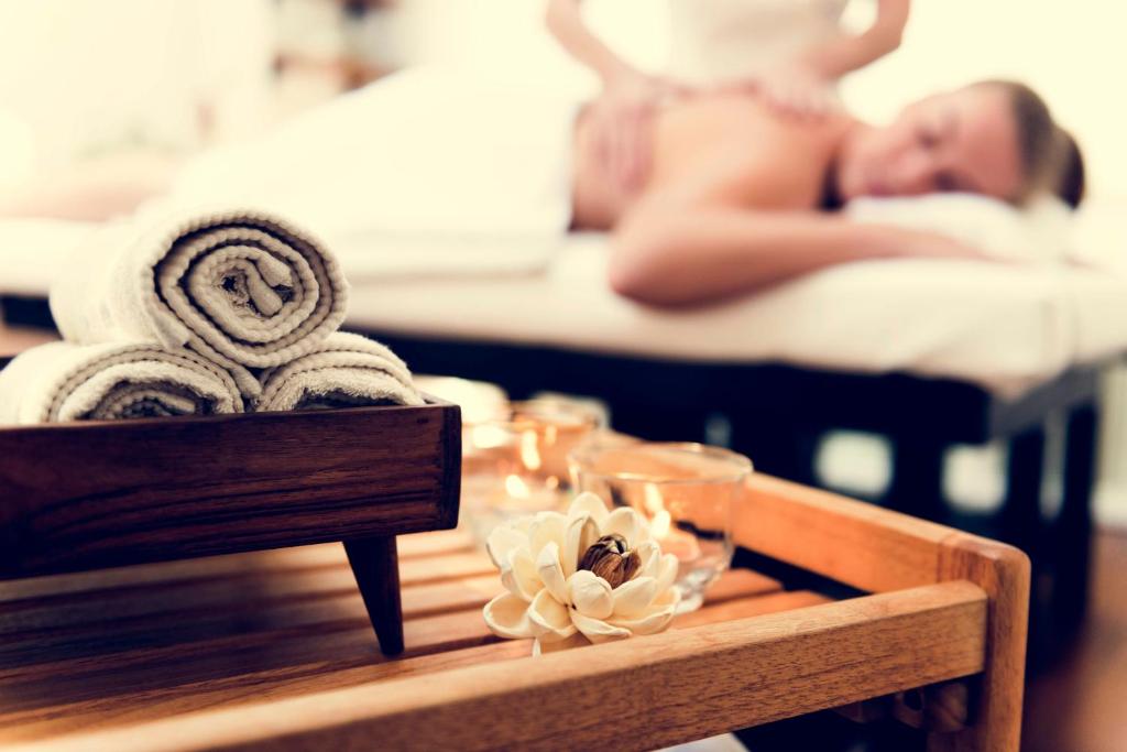 Postel nebo postele na pokoji v ubytování Olympia Wellness Hotel