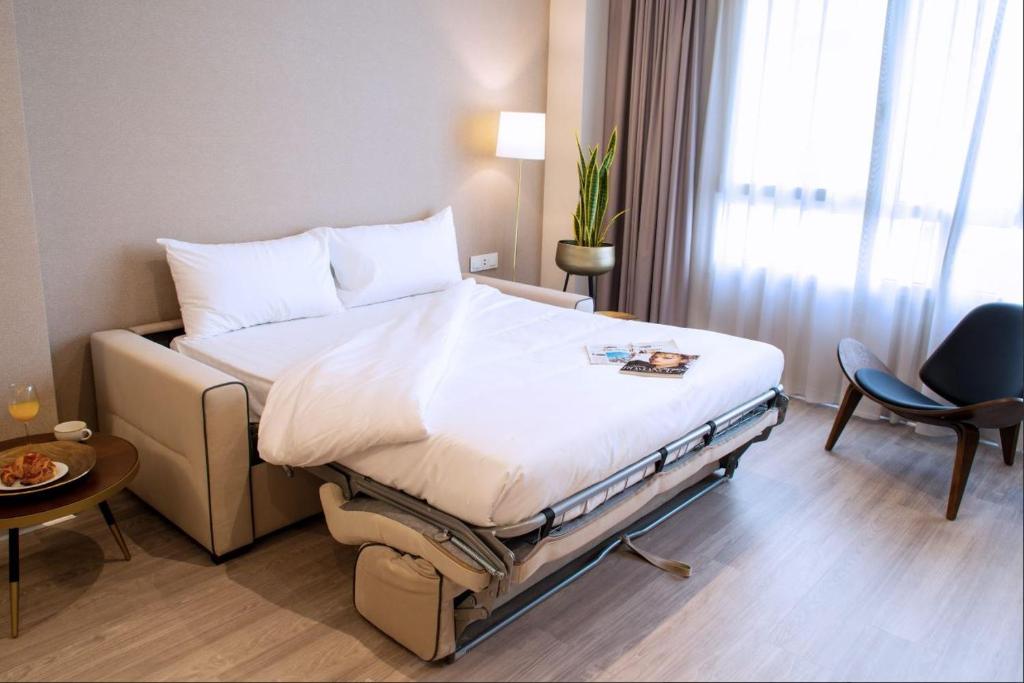 Posteľ alebo postele v izbe v ubytovaní Voghe Premium Flats
