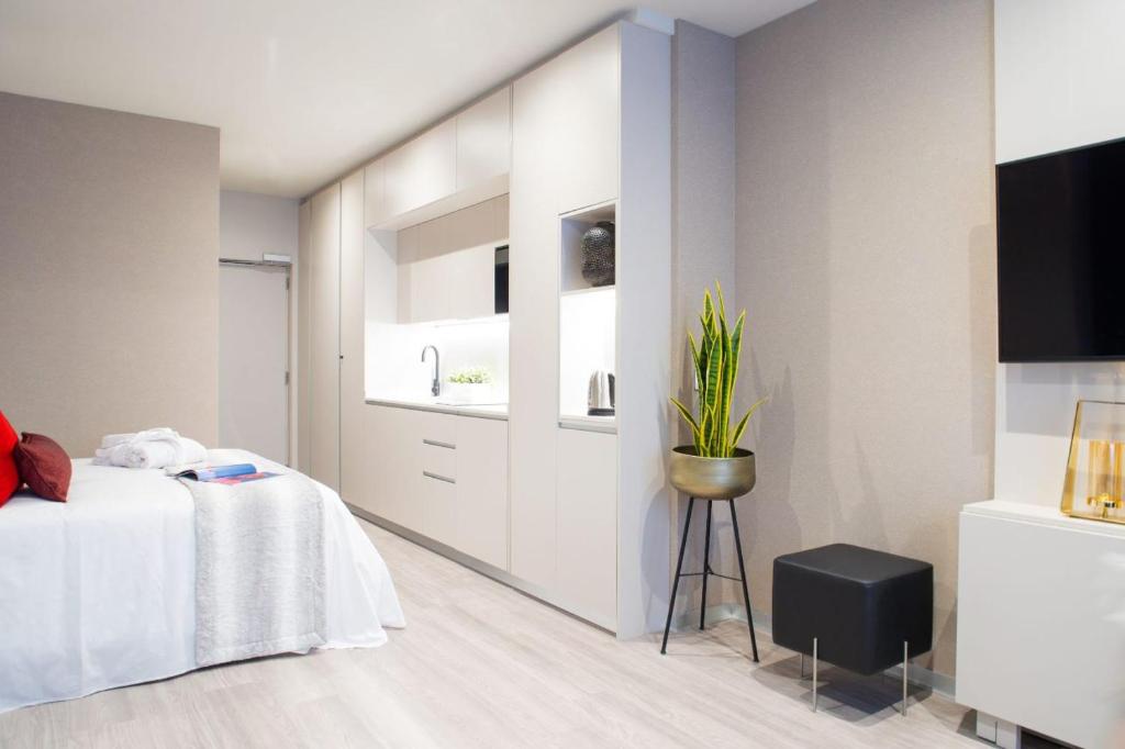 Televízia a/alebo spoločenská miestnosť v ubytovaní Voghe Premium Flats