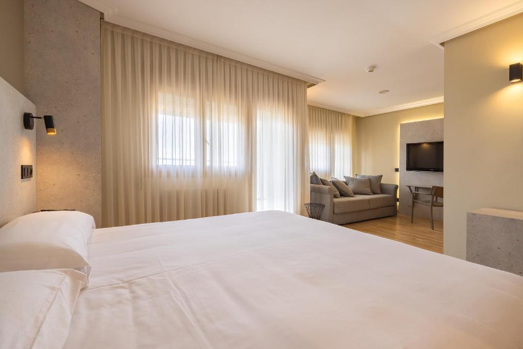 Postel nebo postele na pokoji v ubytování Hotel Santamaria
