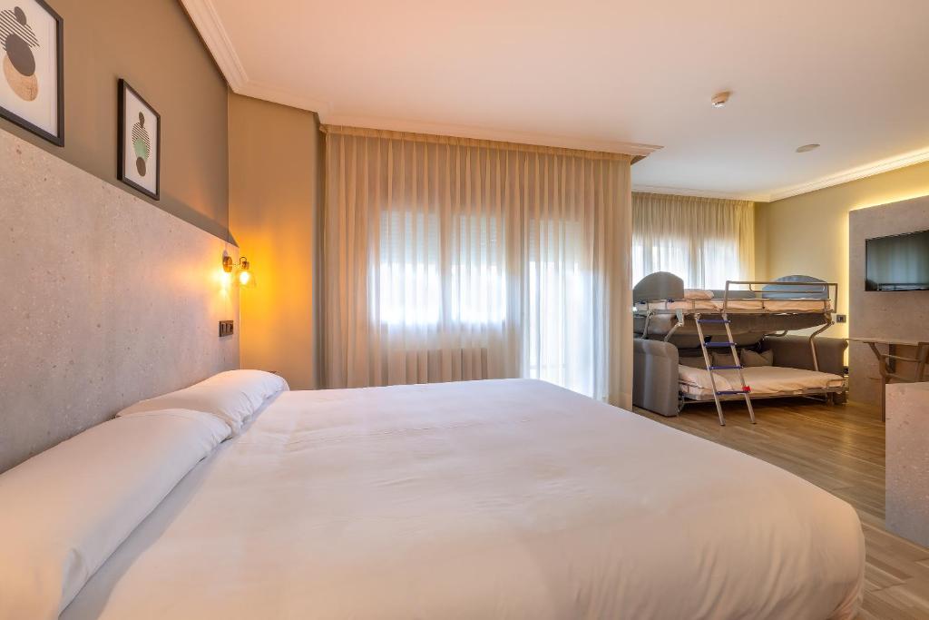 Postel nebo postele na pokoji v ubytování Hotel Santamaria