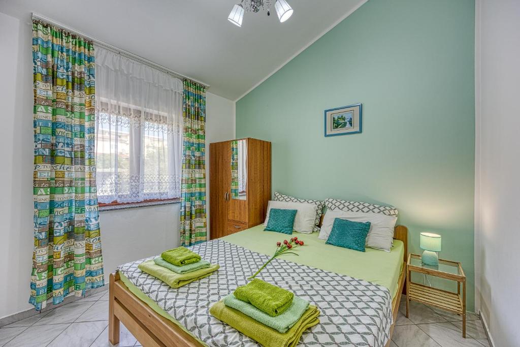 Postel nebo postele na pokoji v ubytování Silver Cherry Apartments