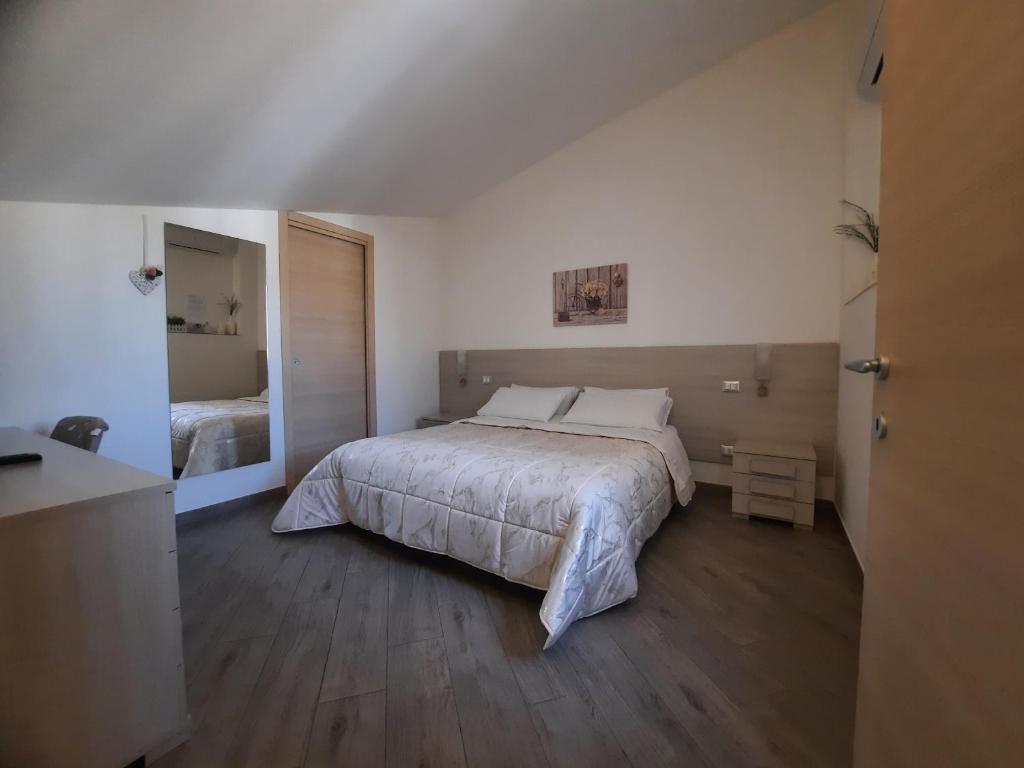 Postel nebo postele na pokoji v ubytování B&B Solimo