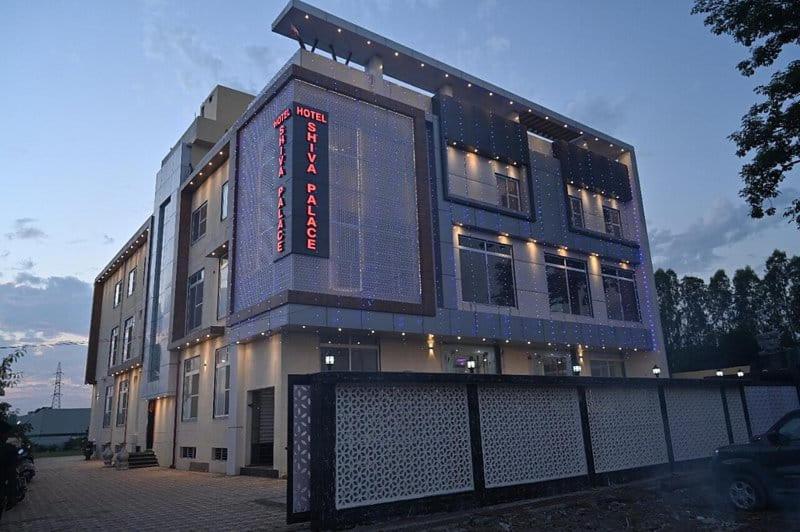 um edifício com um sinal na lateral em Shiva Palace by Golden Leaf Hotels em Haldwani