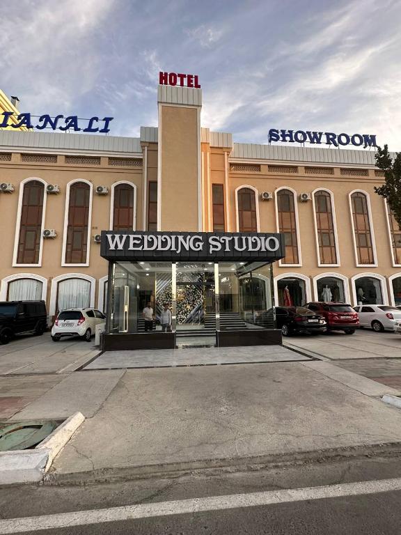 a building with a wedding studio in a parking lot at LIANALI Plaza in Bukhara