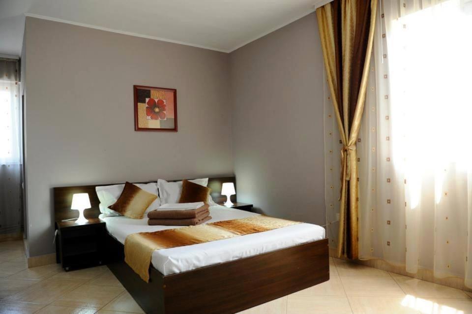 Postel nebo postele na pokoji v ubytování Calla Inn Hotel