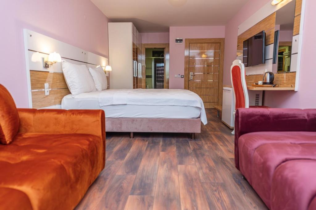 Кровать или кровати в номере TOK EPİK HOTEL