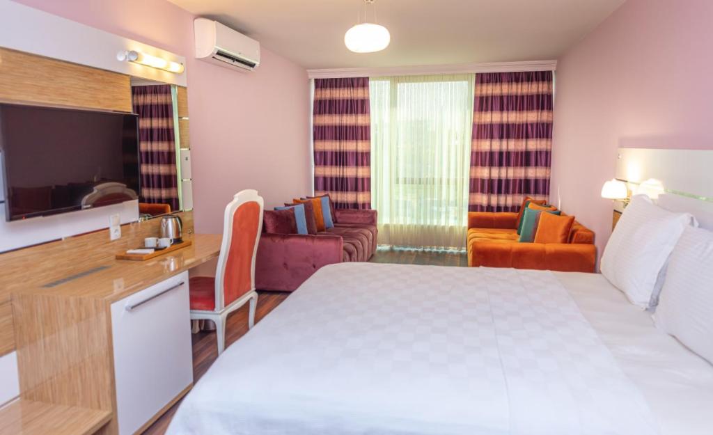 Кровать или кровати в номере TOK EPİK HOTEL