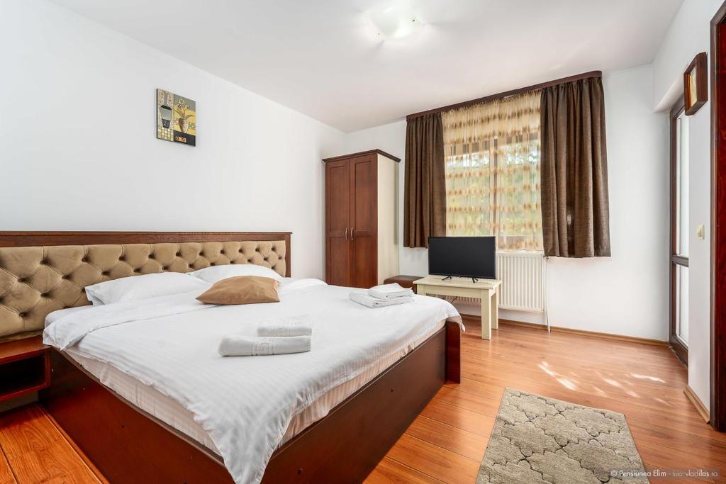 Postel nebo postele na pokoji v ubytování Elim Residence